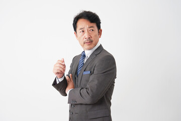 中年のビジネスマンのポートレート　白背景