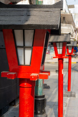 Fototapeta na wymiar A traditional red wooden lantern. Japanese architecture and religion concept.