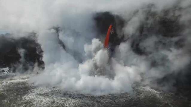 Molten lava flowing into the Pacific Ocean on Big Island of Hawaii