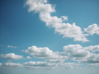 Fototapeta na wymiar Idyllic Skies: White Clouds and Blue
