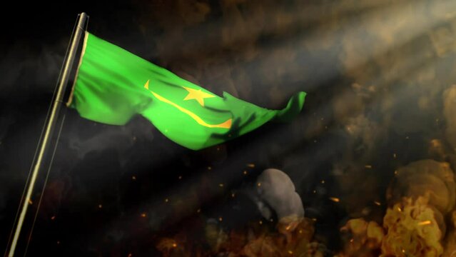 waving Mauritania flag on smoke and fire with sun beams - crysis concept