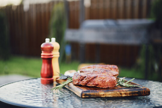 Selective focus photo of grilled striploin steaks on backyard