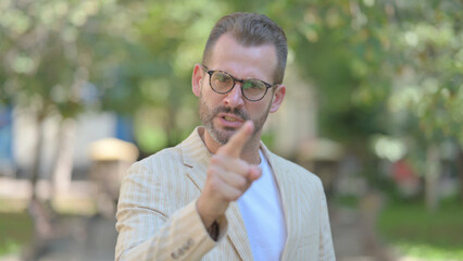 Angry Middle Aged Man Arguing and Screaming Outdoor