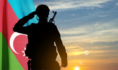 Silhouette of a soldier with Azerbaijan flag against the sunset. EPS10 vector - obrazy, fototapety, plakaty