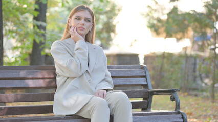 Young Business Lady with Toothache Sitting on Bench