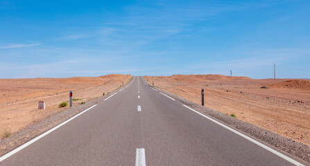 straight road  to a blue sky