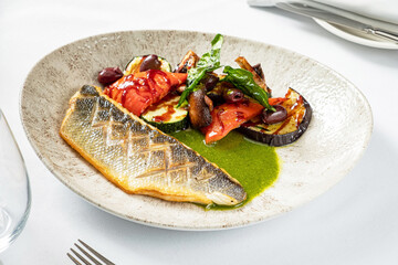 grilled fish with vegetables and sauce