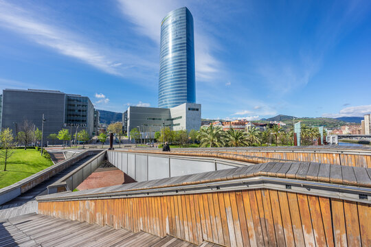 Bilbao, Basque Country, Spain. March 26, 2017: Iberdrola Tower and Deusto University building from Pedro Arrupe footbridge.