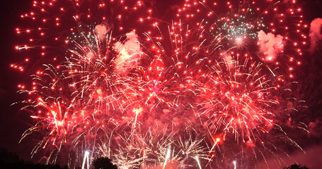Red Firework celebrate anniversary happy new year 2024, 4th of july holiday festival. red firework in night time celebrate national holiday. Countdown to new year 2024 festival party time event