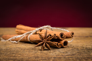 Close up of cinnamon sticks and star anise on wood