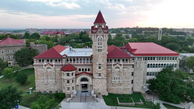 University of Kansas Natural History Museum. Aerial establishing shot of iconic building on college campus in Lawrence, KS. Drone shot during summer sunset.
