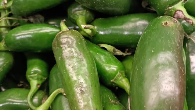 Jalape&ntilde;o chili peppers on display in a supermarket.