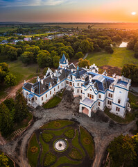Nadasdladany, Hungary - Aerial panoramic view of the beautiful Nadasdy Mansion (Nadasdy-kastely) at the small village of Nadasdladany with rising sun, warm sunlight and blue sky on a summer morning