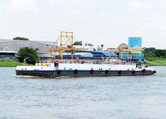 Oil transport ship with industrial factory pier background