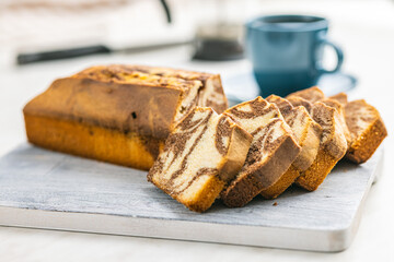 Marble sponge cake. Cake with cocoa and vanilla taste on cutting board.