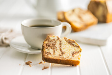 Marble sponge cake and coffee cup. Cake with cocoa and vanilla taste.
