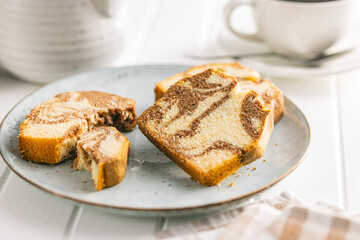 Marble sponge cake. Cake with cocoa and vanilla taste on plate.