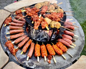 skewers of mixed meats, modern grill