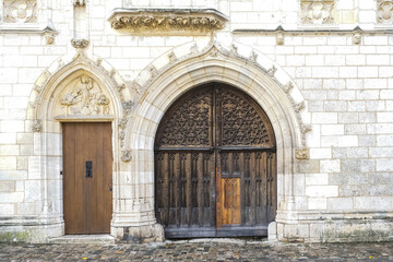Fototapeta na wymiar Bourges, medieval city in France, the Jacques Coeur mansion, beautiful wooden door 