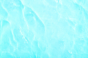 Cosmetic gel close-up with oxygen bubbles. Textured background with microbrushes in cosmetics. Moisturizing skin serum with vitamins and collagen.