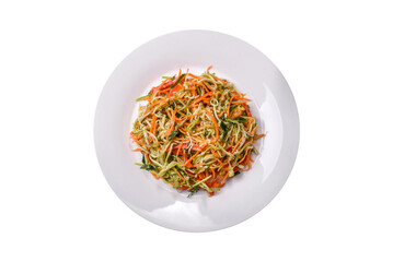 Fresh salad of sliced thin strips of carrot and zucchini on a concrete background