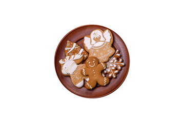 Christmas decoration elements as well as gingerbread on a brown concrete background