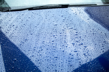 Car part after rain. Water drops