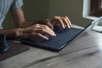 Man working in a computer at home.