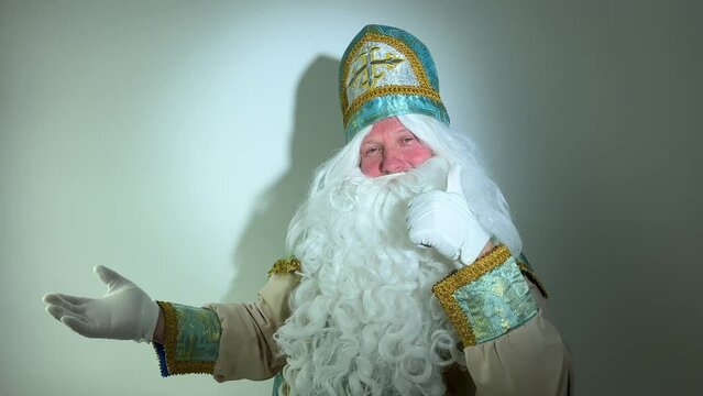 Saint Nicholas pointing finger Yes jerking his hand with his elbow down shows OK thumb up and also at the empty space pointing to the advertisement Take it Buy it Come a great banner advertising stand