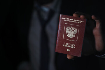 Traveling businessman handing russian passport