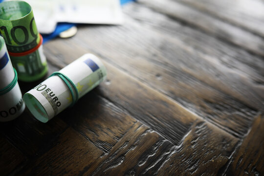 100 euro banknote pack and wood bankground. Currency, financial