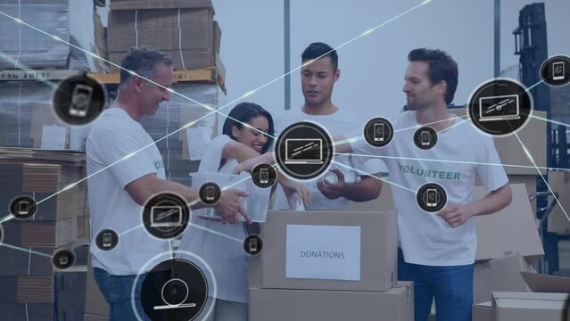 Animation of network of digital icons over team of diverse volunteers keeping items in donation box