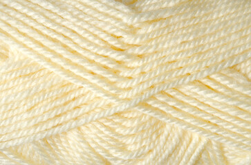 Texture of acrylic yarn, milky color.