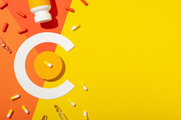 Vitamin C biosupplement, bottle on a light background.