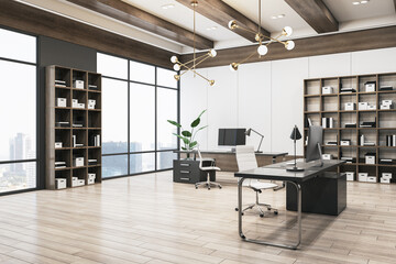 Spacious office interior with wooden and concrete walls and flooring, window with city view and daylight, bookcases and workplace with computer monitor. 3D Rendering.