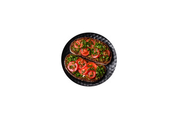 Obraz na płótnie Canvas Tasty bruschetta with tomatoes, mozzarella, basil, spices and herbs