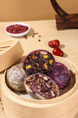 Chinese bean buns made from cereals and grains (purple sweet potato, black rice, red beans, red dates, peanuts), traditional Chinese snacks, healthy breakfast
