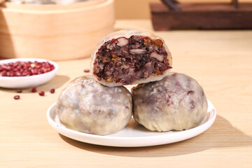 Chinese bean buns made from cereals and grains (purple sweet potato, black rice, red beans, red dates, peanuts), traditional Chinese snacks, healthy breakfast