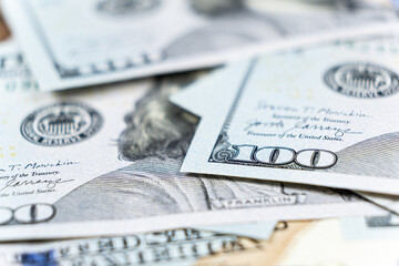 A lot of 100 dollar bills close-up macro.