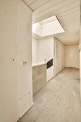 an empty room with white walls and carpeted floor, there is no one person in the room to be seen