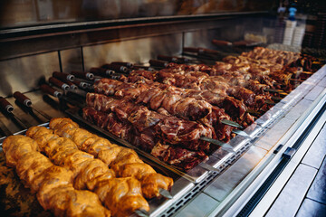 traditional caucasian shish kebab at street food market. grilled meat on skewer