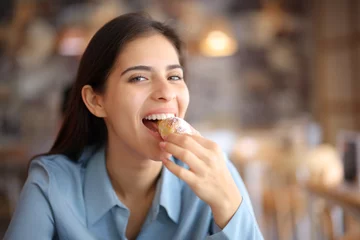 Fotobehang Happy bar customer looking at you eating croissant © PheelingsMedia