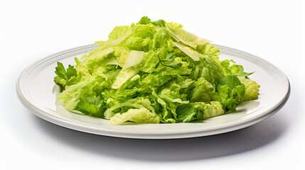 A plate of shredded lettuce on a white background