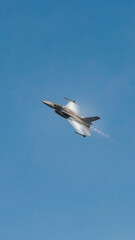 Fighter jet flying in the blue clear sky demonstrating skills_7