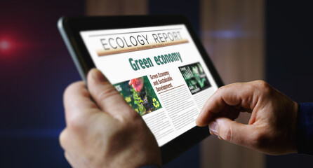 Fototapeta na wymiar Green economy eco friendly economy newspaper on mobile tablet screen