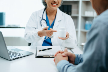 Asian Doctors explain the use of medication to patients. healthcare and medical concept.