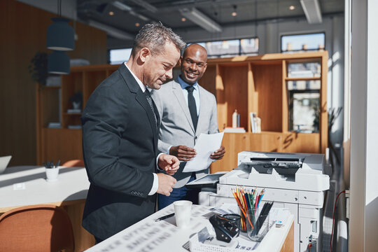Smiling diverse businessmen at work in a office