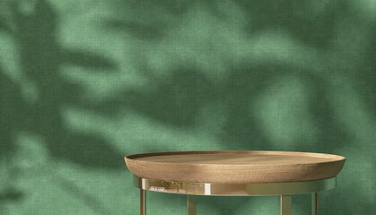 Round wooden table podium tray, gold steel leg in sunlight, leaf shadow on green fabric texture wallpaper wall. Luxury beauty, cosmetic, skincare, body care, food, drink product display background 3D