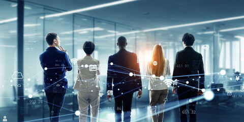 Group of people standing in futuristic office and communication network concept. Wide angle visual...