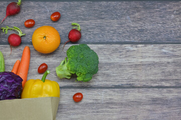 Healthy food background, healthy vegetarian food in paper bags, fruits and vegetables, banner copy...